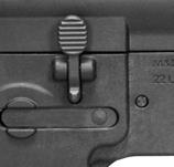 While keeping the muzzle pointed in a safe direction, remove the magazine and lock your bolt open as instructed here and then rotate the safety selector to