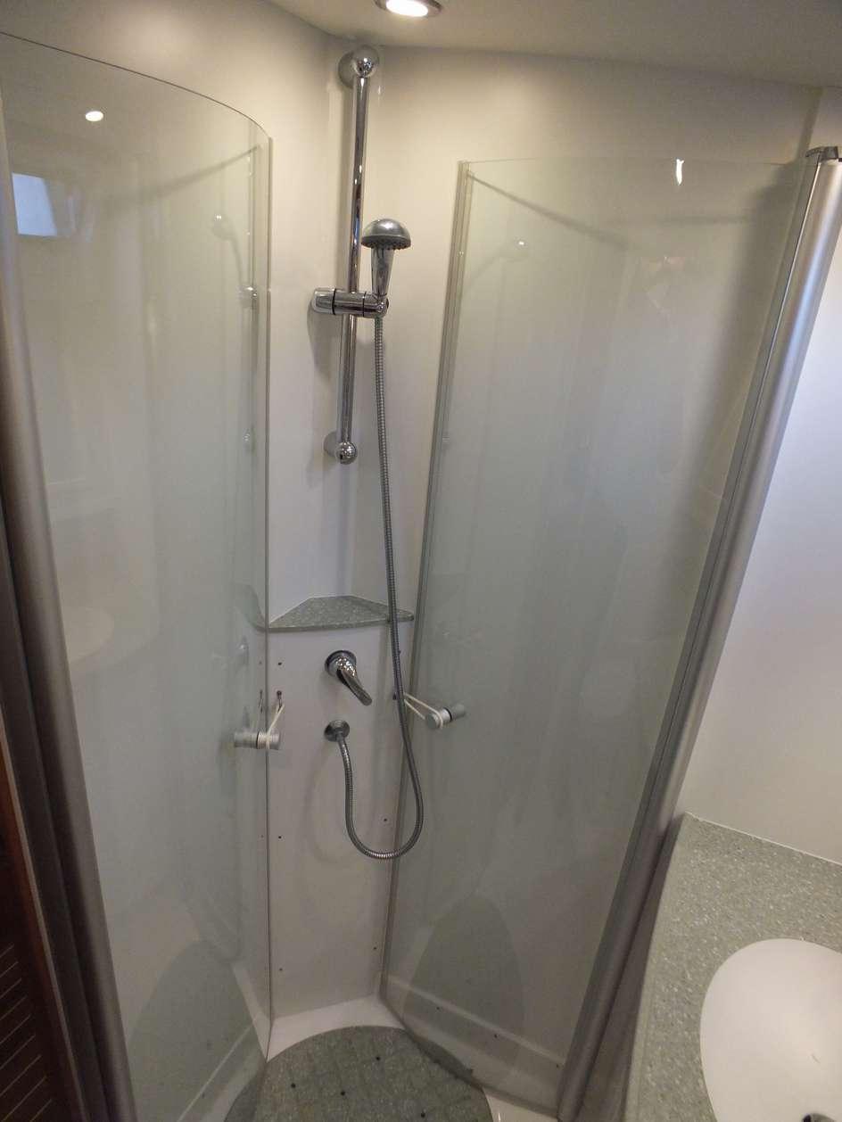 doors Separate mixer shower head and separate fold out shower compartment Raritan