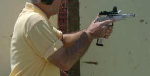 The weak hand stays in position about 3 or 4 inches in front of the sternum. The trigger finger is extended alongside the pistol, ready to point at the target.