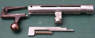 which locks the bolt solidly in place. Unless the bolt is fully locked the firing pin cannot be release, thereby achieving mechanical safety at the time of firing.