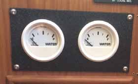 Water Tanks: Water Systems to the right of the helm and will indicate the levels when the fresh water breaker is turned on at the tank is about 3/8 full. Forward Aft Gray Water: drain pump.