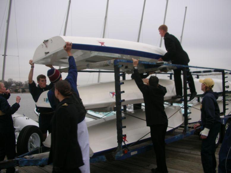 Figures 3 and 4: Unloading dinghy Ergonomics Issue Description: The ergonomics risk factors associated with dinghy storage and retrieval involve heavy lifting and awkward postures.