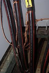 These wires transmit the high-voltage electrical energy to transformers in regional locations that lower the voltage so the energy can be used in homes.