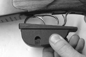 To open the Trigger Lock put the Key into the notches of the Trigger Lock Nut and un-screw it