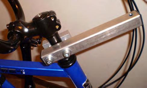 STEERING ASSEMBLY 7) Find steering levers and attach to handle bar stem, about the same distance (on both bikes) up from the head tube, with two 8mm x 45mm machine screws & washers as shown in