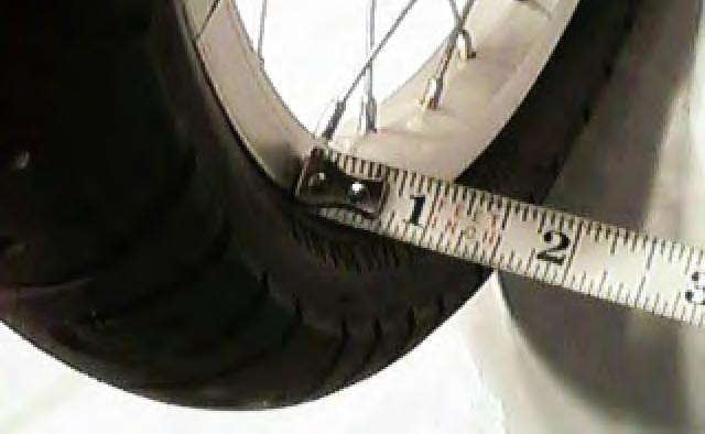 Figure 11 Figure 9 FRONT END WHEEL ALIGNMENT 10) Check front-end wheel alignment by measuring the distance between the front rims of the two bikes as shown in figures 10, 11 & 12.