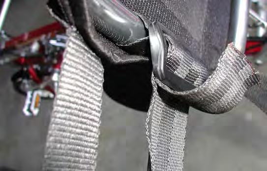 Thread the end of the seatbelt through the tri-glide fastener and then around the exposed seat frame as shown in figure 15.