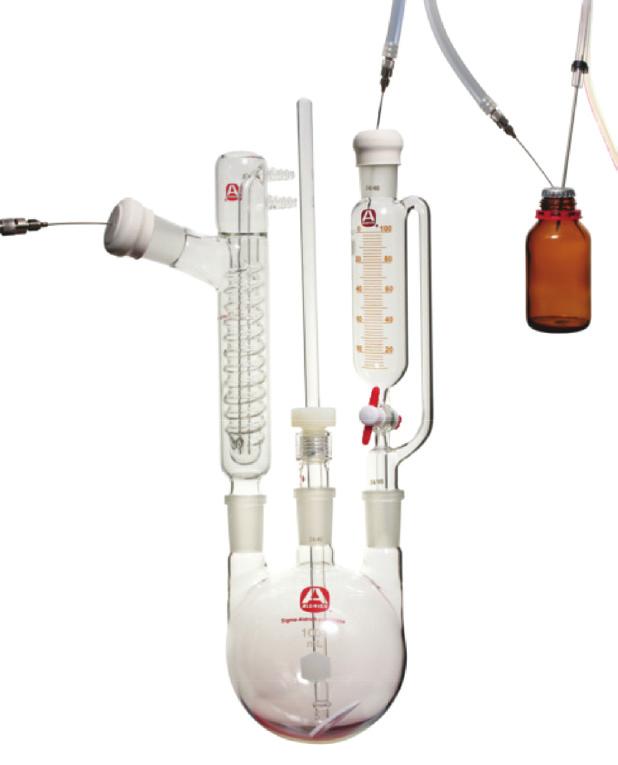 other end of the double-tipped needle is inserted through the septum on the reaction apparatus, and the end of the needle in the reagent bottle is pushed down into the liquid.