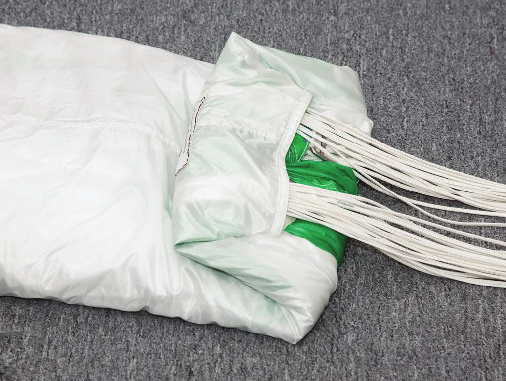 Cocoon the canopy to the width of your deployment bag: Make your first S-fold: