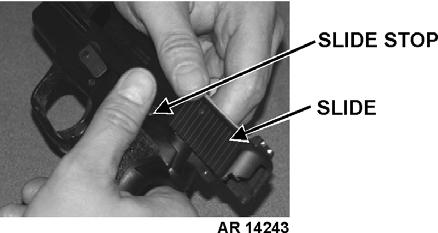 6-2 b. Hold pistol in right hand with muzzle slightly elevated.