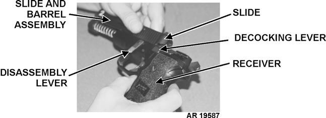 c. Use thumb to rotate disassembly lever DOWN until it stops.