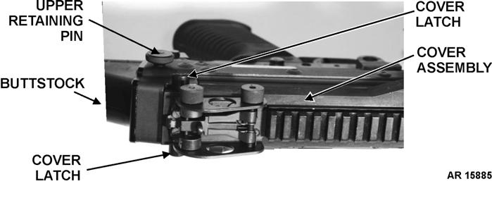 c. Squeeze cover latches together and raise cover assembly. d. Remove blue CCMCK feed tray adapter. e. Check to ensure bolt is in FORWARD position. f. Pull upper retaining pin at rear of receiver to the LEFT.