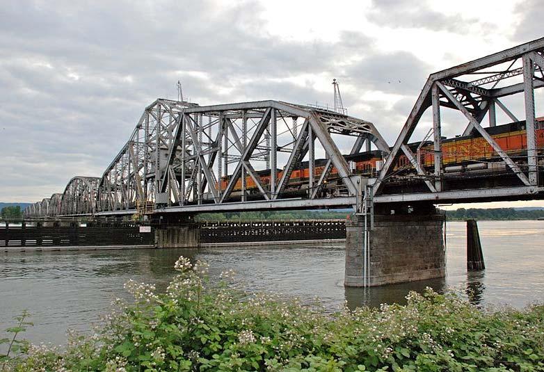 Bridge is 8,288 ft long with a 1200 foot main span and 210 ft of vertical clearance. Northern Pacific Railroad Bridge 9.