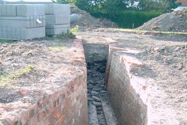 The trench was constructed in brick and has several firing positions for one man. The trench was discovered while building a house.