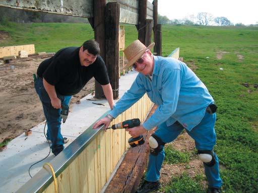 David Anderson & Kerry Williams installing rain caps Forrest