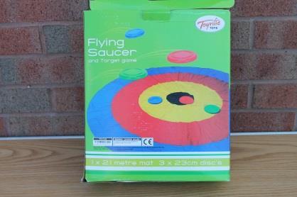 Flying Saucer Target Game This plastic flying saucer game comes with a target mat. Aim of the game is to see who can throw the saucers closer to the target.