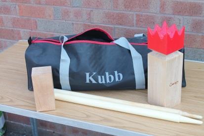 Kubb Kubb can be played almost anywhere. It is perfect for 2 12 players and for any age. It is a lawn game where the object is to knock over wooden blocks by throwing wooden batons at them.