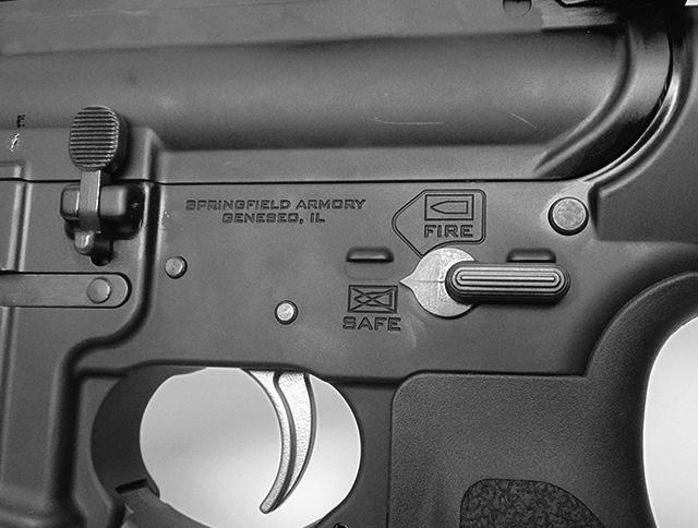 With your finger off trigger fully retract charging handle, ejecting cartridge. 4. Release/lower charging handle. 5. Press lower position of bolt catch (Figure 21-2).