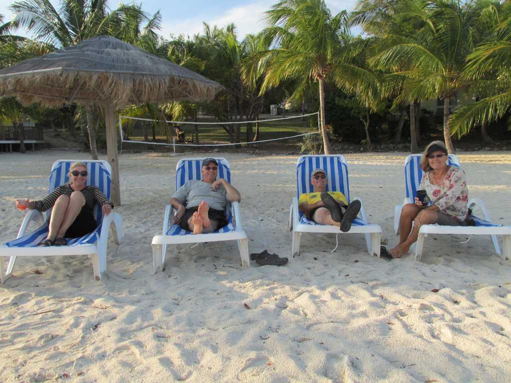 The four intrepid travelers are taking a break on the beach at