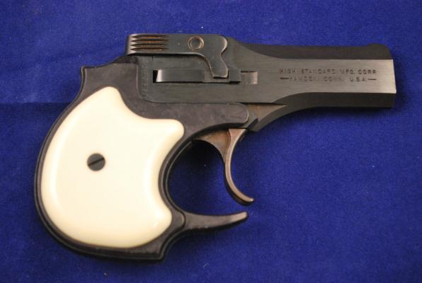153. High Standard Two-Shot Break-Top Derringer Serial # 1963692, 22 S/L/LR caliber, 3-1/2" barrel, with near excellent bore. The finish is about 98% and the plastic grips are very good.