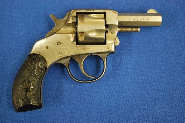 No manufacturer s or import marks, probably because two revolvers were made into one to make a two-tone revolver, and the marked parts were not the ones used.