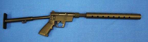 The rifle is the collapsing stock version of the AR-7, and the barrel with ventilated handguard detaches by hand with a barrel nut.