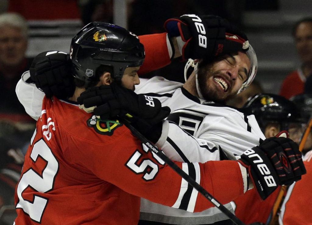 The Chicago Blackhawks' Brandon Bollig, left, dukes it out with Dwight King of the Los Angeles Kings during Game 7 of the Western Conference finals in the Stanley Cup playoffs in 2014.