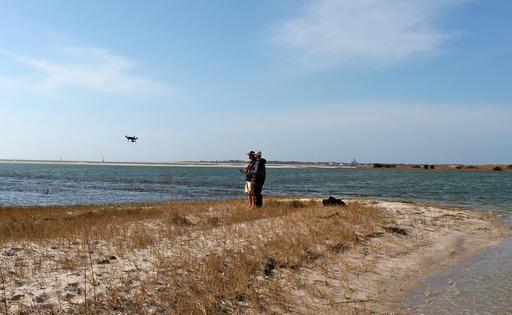 , uses a drone to detect sharks in coastal Service's Cape Cod headquarters in Wellfleet, Mass. The waters.