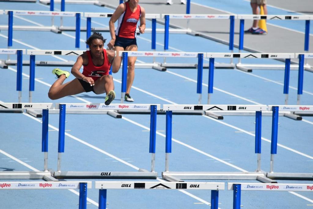 FEATURE STORY ABOUT THE PRESSURES OF PERFORMING AT A HIGH LEVEL AS AN ATHLETE Running the hurdles at the Iowa State Co- Ed track meet on May 21 is East senior Dimetrea