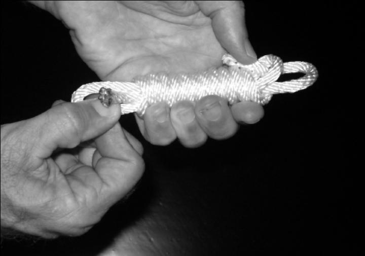 Holding the entire knot in one hand,