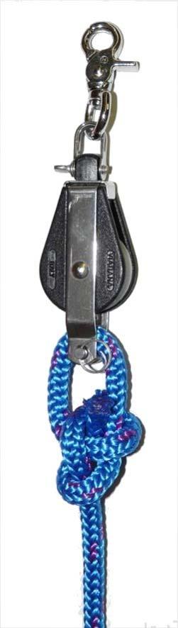 - Shackle fiddle block to eye strap on hull.