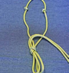 Pull the access rope through the fiador knot and to the end of the rope. Pull and tighten the fiador knot. 3 12.