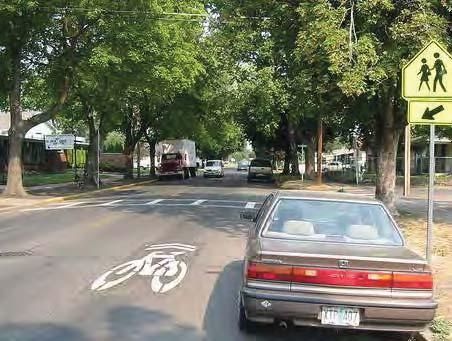 Shared Lane Markings delineate the bicyclist path away from opening car doors and inform motorists ofthe presence of bicyclists. 3.7.1.
