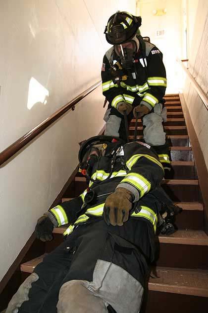 Page 14 of 20 in opposite directions under both shoulder straps, it will provide two short loops to grab, giving the firefighter the leverage and control to manipulate the downed firefighter up the