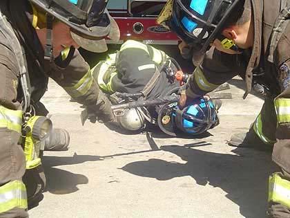 This is similar to the halligan tool rescue but in this case the firefighter has a halligan hook or a pike pole.