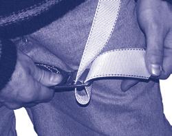 Figure 21 - Step-in Style Harness Buckle Connections Tongue Buckle: Pass webbing through buckle and insert tongue through grommet.