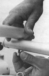 Tiller Crossbar To attach tiller crossbar to tiller arms, remove 1/4 bolt, washer and lock nut from end of tiller arm.
