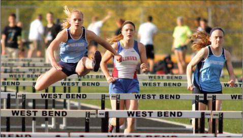 West Bend East s Katie Opgenorth begins the 800-meter relay race during the Wisconsin Little Ten Championship on Tuesday in West Bend.