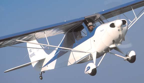 Bill Pancake and his grandson Michael Boggs cruise in Bill s custom Champ, winner of the Outstanding Aeronca Champ plaque at EAA AirVenture Oshkosh 2003.