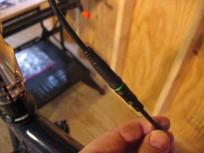 Connect the display wire to the front harness, matching up the green tips.