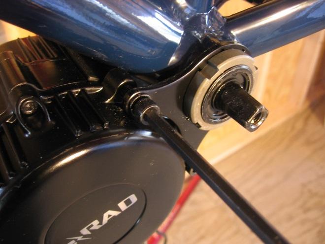 Position the pad where the motor might contact the frame, on the front of the bike s
