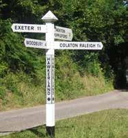 Landmark: The white old fashioned finger post at Hawkerland crossroads. Turn left to Woodbury.