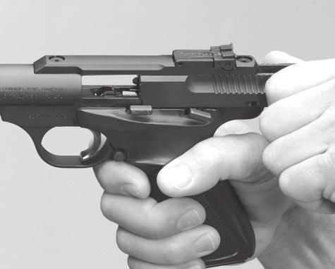 pressure and feed the first cartridge from the magazine into the chamber (Figure 7). THE PISTOL IS NOW READY TO FIRE.