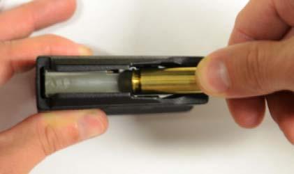 the magazine. All cartridges must be loaded in this orientation. See Figure 2. 3.