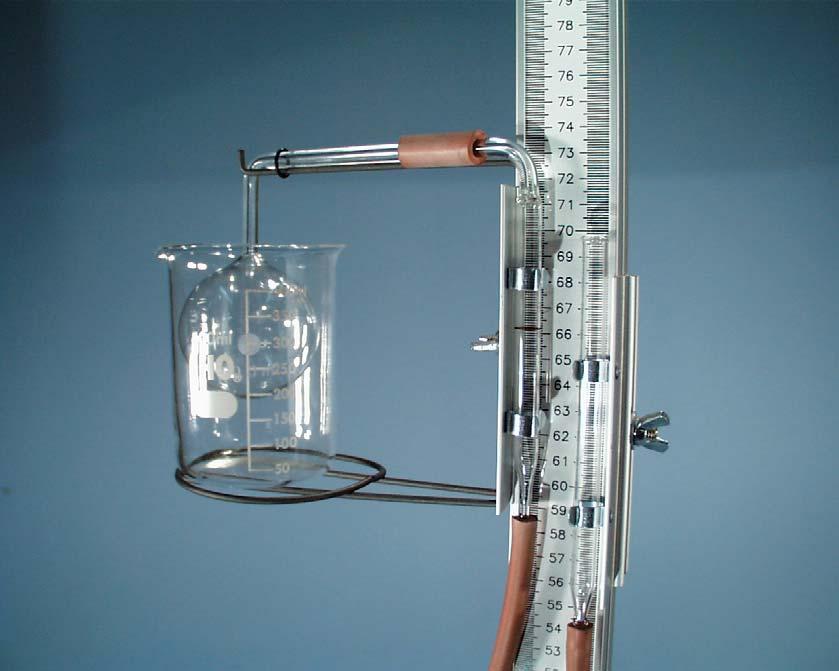 With the two glass tubes side by side, pour the mercury into the open glass tube so that the mercury reaches the reference mark on the glass tube with the bent leg.