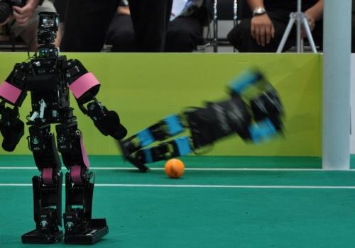 If the arms are not up at the time of the ground impact, the goalie may be injured by the fall and the blocking distance would also be shorter since the arms would not reach as far when the robot