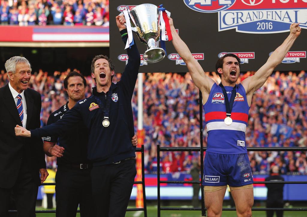 6 THE ULTIMATE: The moment that Bulldogs fans have been waiting 62 years for the premiership cup in the hands of injured captain Bob