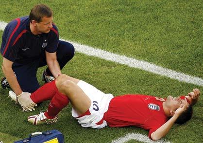 Image: Owen receives treatment on the pitch after injuring his knee in England s 2006 World Cup match against Sweden.