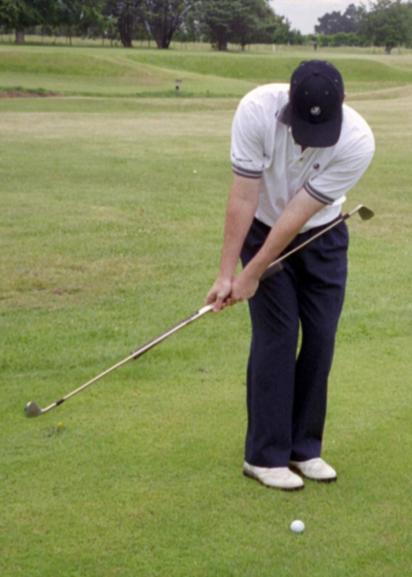 Once this is in place simply chip as normal and if you find that on your follow-through you hit your body with the extended club, then that is a sure