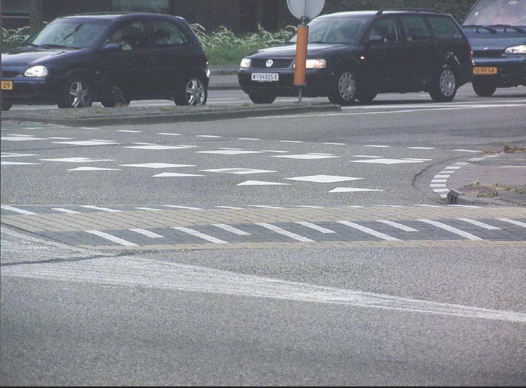 Speed table in turning lane to slow turning traffic - Netherlands